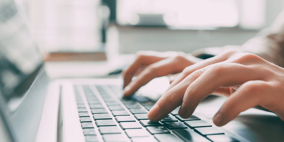 hands-typing-on-laptop
